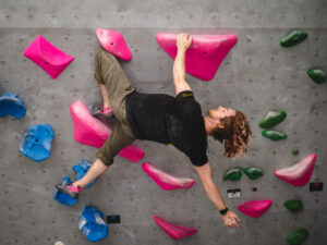 A climber using a knee bar